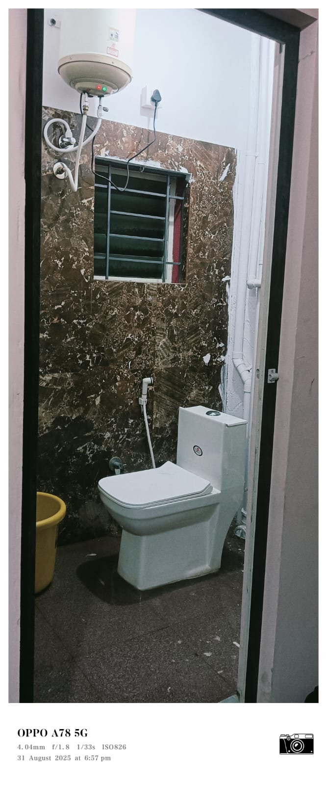 Attached bathroom with toilet and geyser